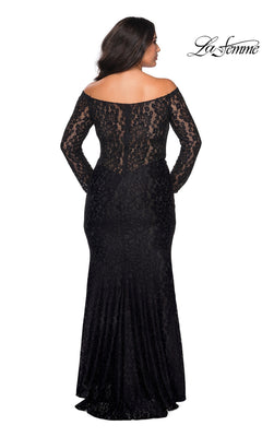 Back view of a woman wearing the Long Plus-Size Prom Dress: La Femme 28945, a black, long-sleeved, off-the-shoulder lace dress with a floor-length skirt.