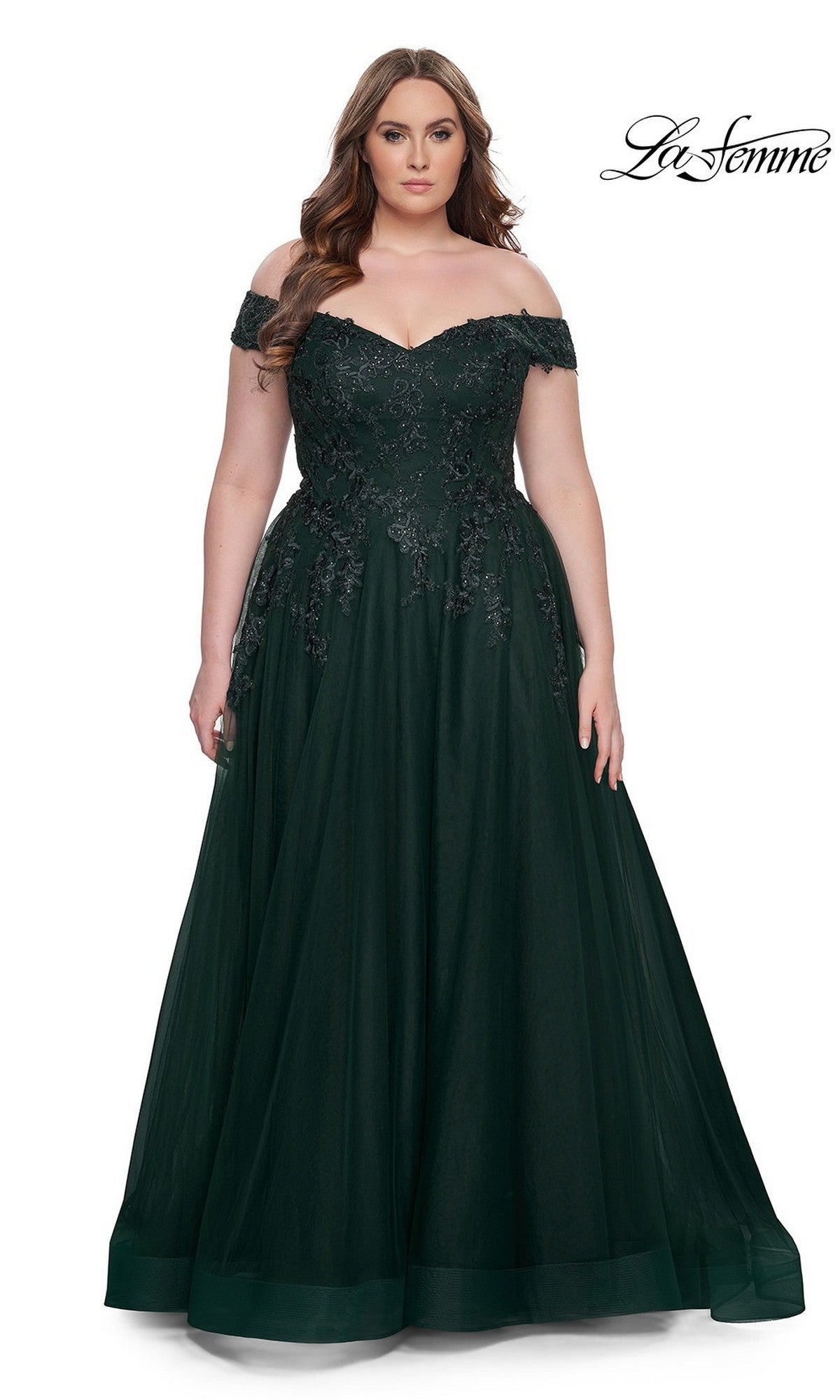 A woman models the Off-the-Shoulder Plus-Size La Femme Prom Ball Gown in dark green with lace and beaded details against a white background. The La Femme logo is displayed in the top right corner.