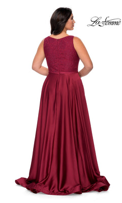 Back view of the Long Plus-Size Prom Dress: La Femme 29004, a deep red, sleeveless, floor-length gown with a lace bodice and a solid, pleated A-line skirt.
