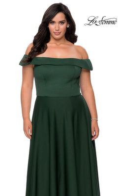 A woman models the Long Plus-Size Prom Dress: La Femme 29007 in floor-length dark green, off-the-shoulder, against a white background with the “La Femme” logo top right.