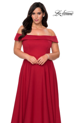 Woman in the Long Plus-Size Prom Dress: La Femme 29007, a floor-length red off-the-shoulder gown with fitted bodice, stands against a white background; “La Femme” logo top right.