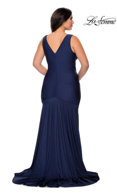 Back view of a woman wearing a La Femme 29016 long plus-size prom dress in a floor-length, sleeveless navy blue mermaid-style jersey.