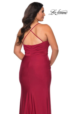 Back view of a person in a floor-length red stretch jersey Long Plus-Size Prom Dress: La Femme 29022 with thin, crisscross back straps.