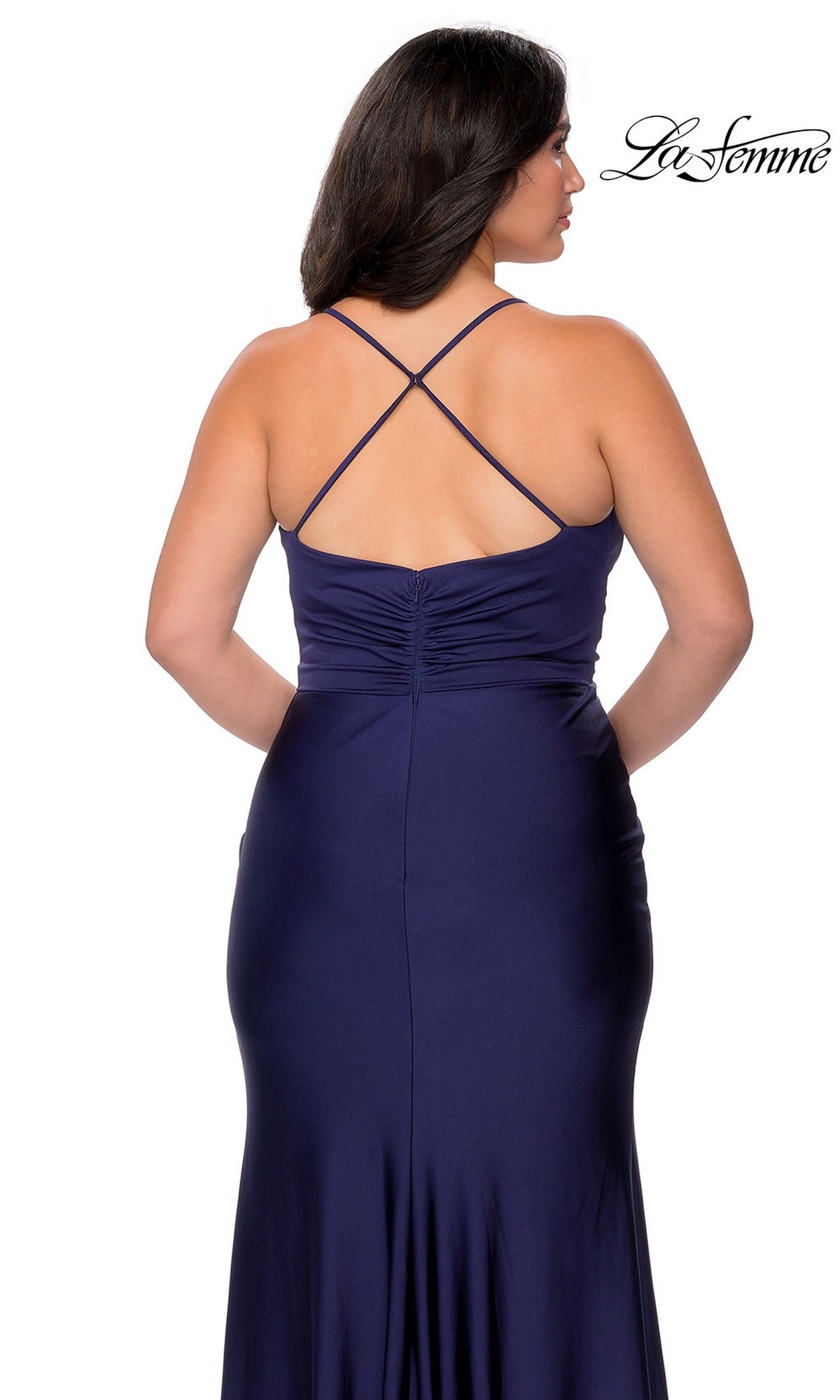 Back view of the Long Plus-Size Prom Dress: La Femme 29022, a floor-length dark blue evening gown with a ruched bodice and crisscross spaghetti straps.