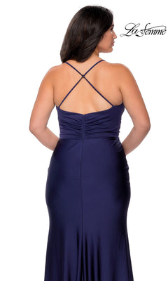 Back view of the Long Plus-Size Prom Dress: La Femme 29022, a floor-length dark blue evening gown with a ruched bodice and crisscross spaghetti straps.