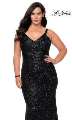 A woman wearing a black, floor-length, sequined V-neck open-back La Femme 29037 prom dress with spaghetti straps.