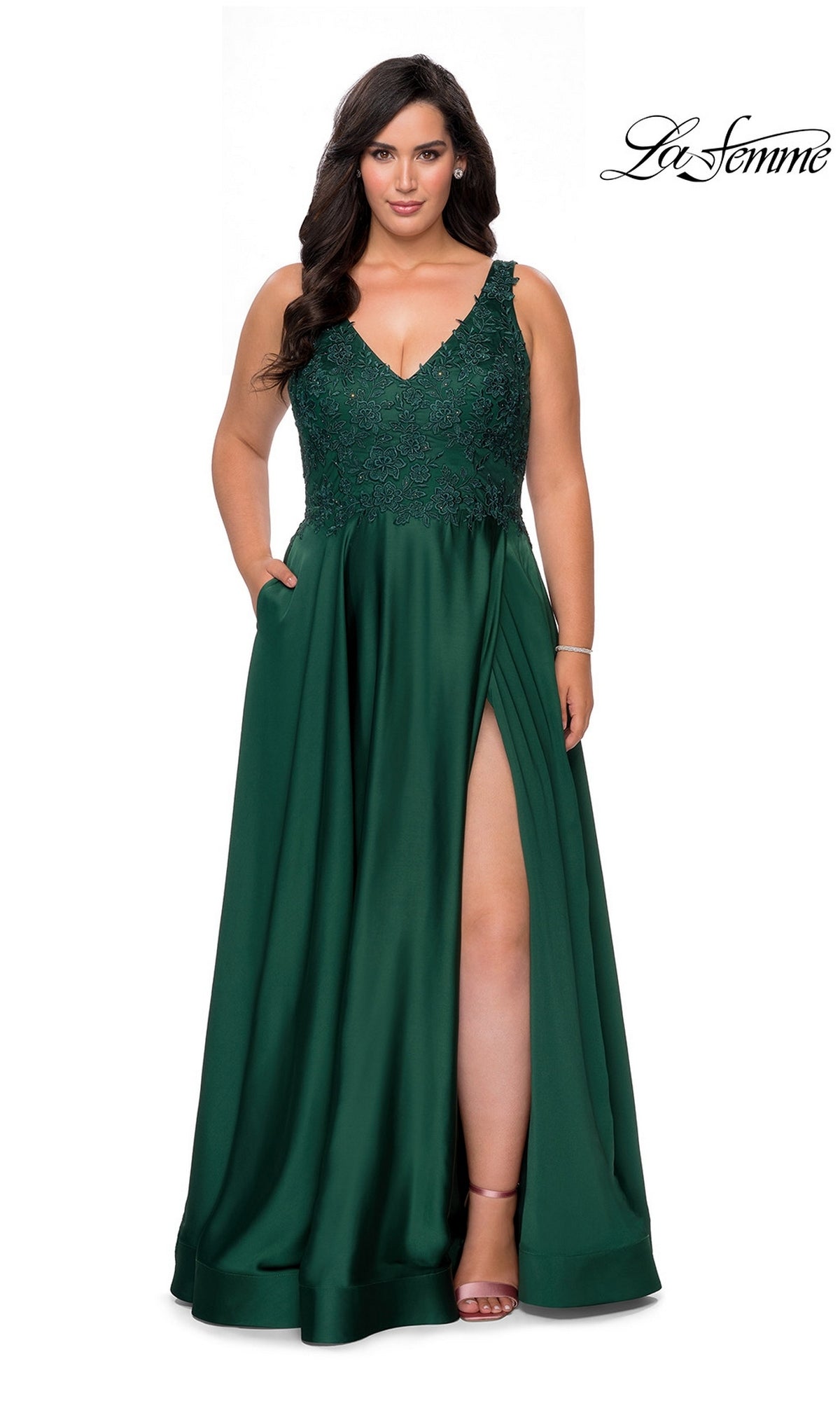 La Femme 29039 emerald green satin plus-size prom dress featuring a beaded V-neck bodice, a full skirt with a side slit, and pockets.