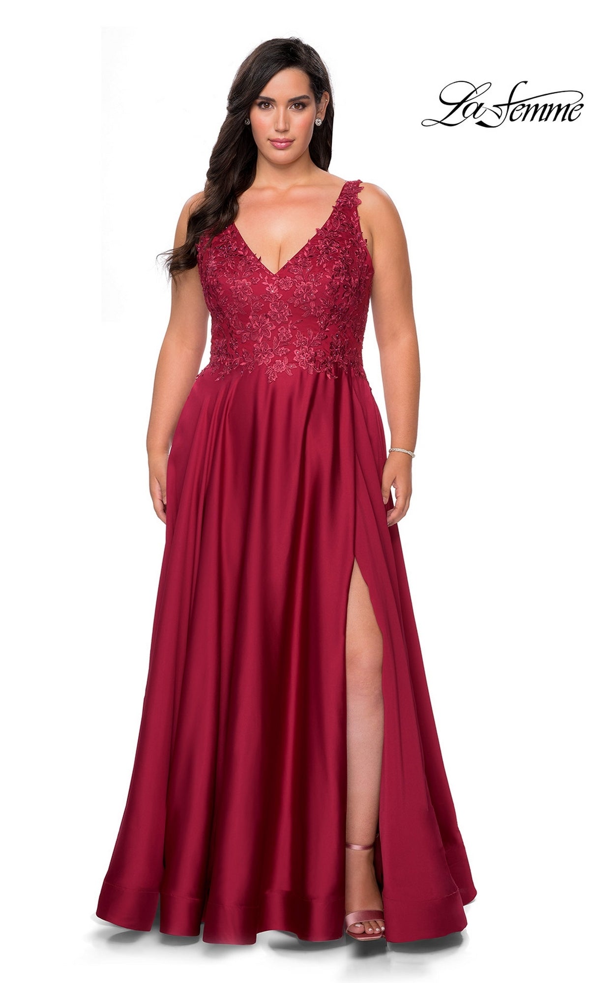 La Femme 29039 wine-colored plus-size floor-length gown featuring a V-neckline, floral lace bodice, side leg slit, and pockets.