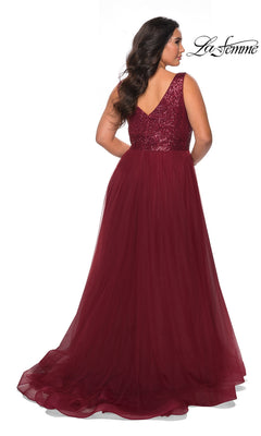 Woman shown from the back wearing La Femme 29045, a sleeveless long plus-size prom dress with sequin bodice and burgundy tulle A-line skirt.