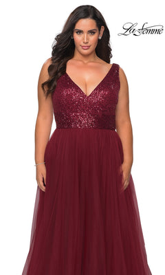 Woman in Long Plus-Size Prom Dress: La Femme 29045—sleeveless, burgundy, with sequin bodice & tulle A-line skirt. “La Femme” logo in top right on white background.