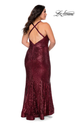 The La Femme 29051 long plus-size prom dress in dark red features a floor-length sequin mermaid silhouette with a fitted cut and a crisscross back.