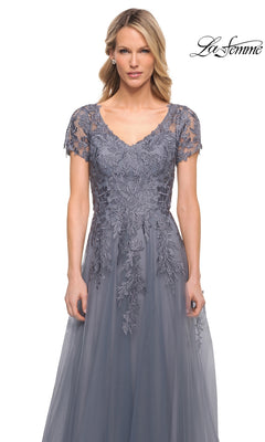 Woman wearing a slate grey, modest Long Formal Dress: La Femme 29164 with a V-neckline and floral lace embroidery on the bodice.