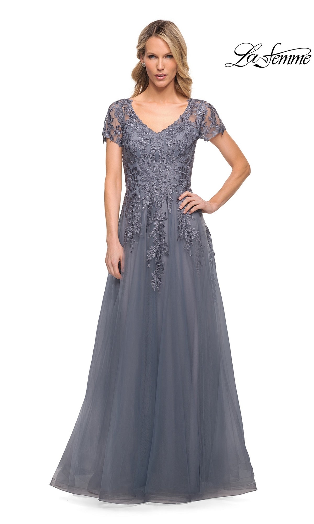 The La Femme 29164 is a floor-length grey mother-of-the-bride dress featuring a V-neckline, short sleeves, and a modest lace bodice with floral embroidery.