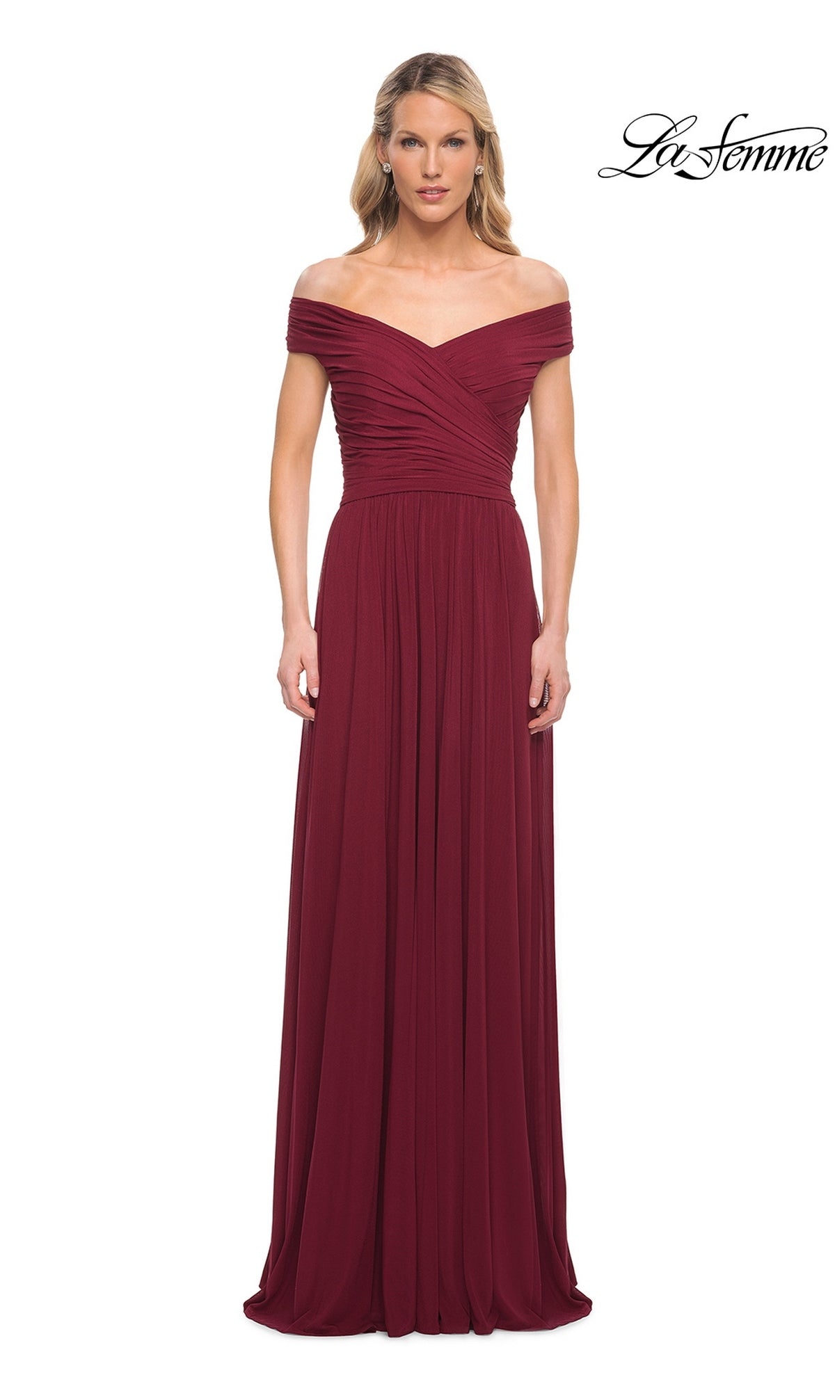 A woman wears the Long Formal Dress: La Femme 29168 in wine, featuring an off-the-shoulder ruched bodice and A-line skirt. The La Femme logo appears top right.