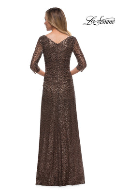 Woman in a brown sequin Long Formal Dress: La Femme 29195 with three-quarter sleeves, fitted sheath style, shown from the back on white. “La Femme” logo top right.