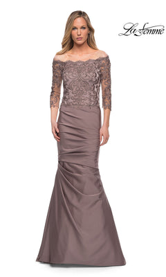 Woman wearing a cocoa off-the-shoulder Long Formal Dress: La Femme 29324 with beaded lace bodice, sheer sleeves, and fitted trumpet silhouette. “La Femme” appears in the top right corner.