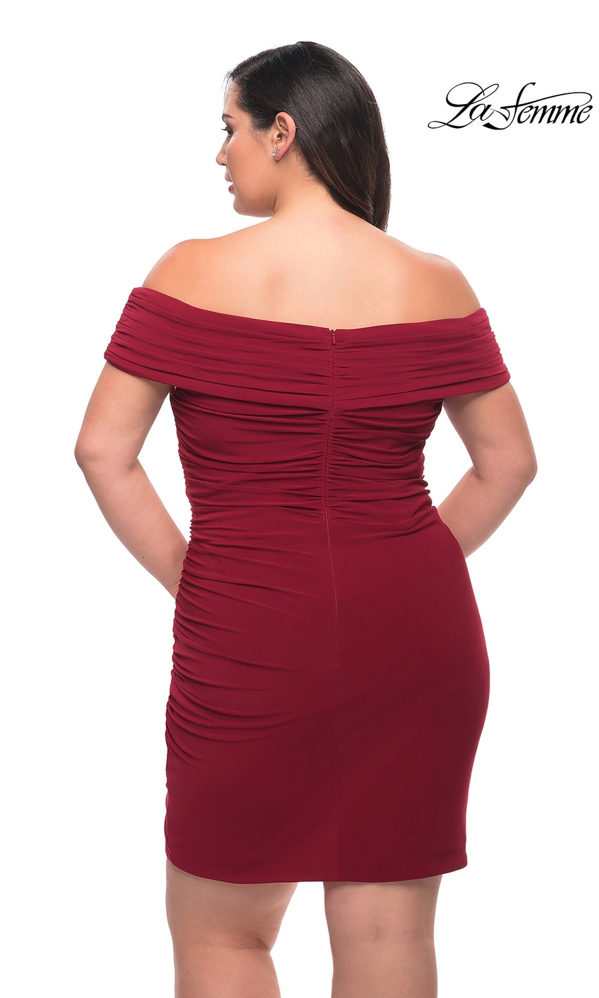 A woman is shown from the back wearing the La Femme Plus-Size Sexy Cocktail Party Dress 29521, a fitted off-the-shoulder ruched burgundy style, with the La Femme logo in the top right corner.