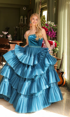 A woman in the Long Prom Dress 29529 by Ava Presley, featuring a strapless A-line design and beaded waist, stands indoors near a window with flowers, a piano, and a guitar in the background.