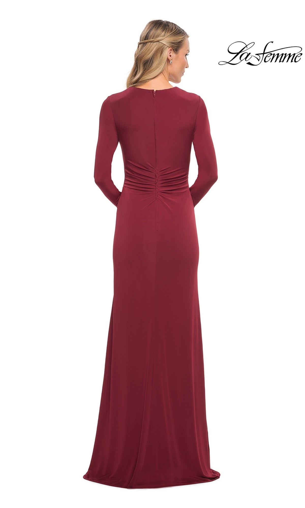 Back view of a burgundy La Femme 29535 long-sleeve formal floor-length gown with ruched detailing at the lower back.