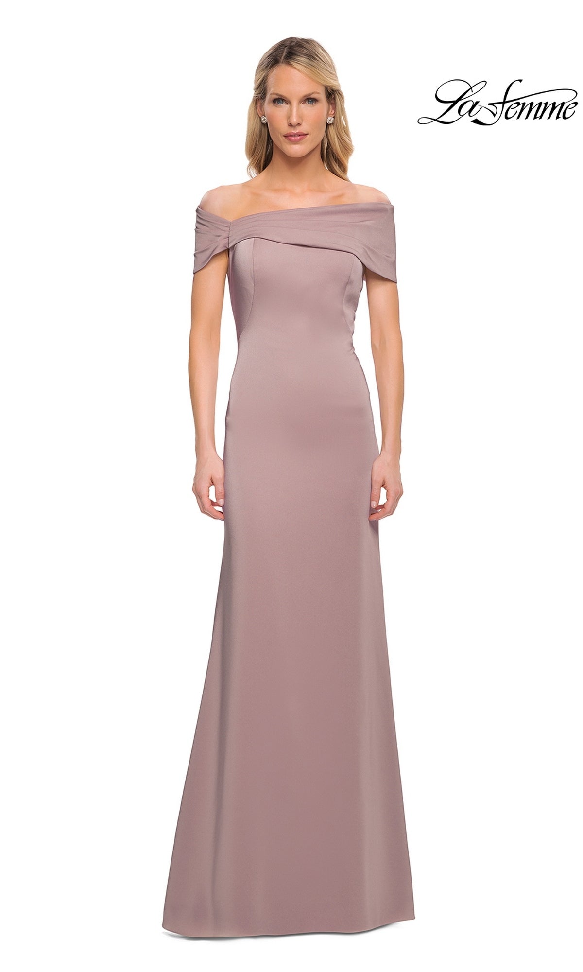 A woman wearing the Long Formal Dress: La Femme 29537 in mauve, a floor-length fitted sheath gown with an off-the-shoulder design, stands against a white background featuring the “La Femme” logo in the top right corner.