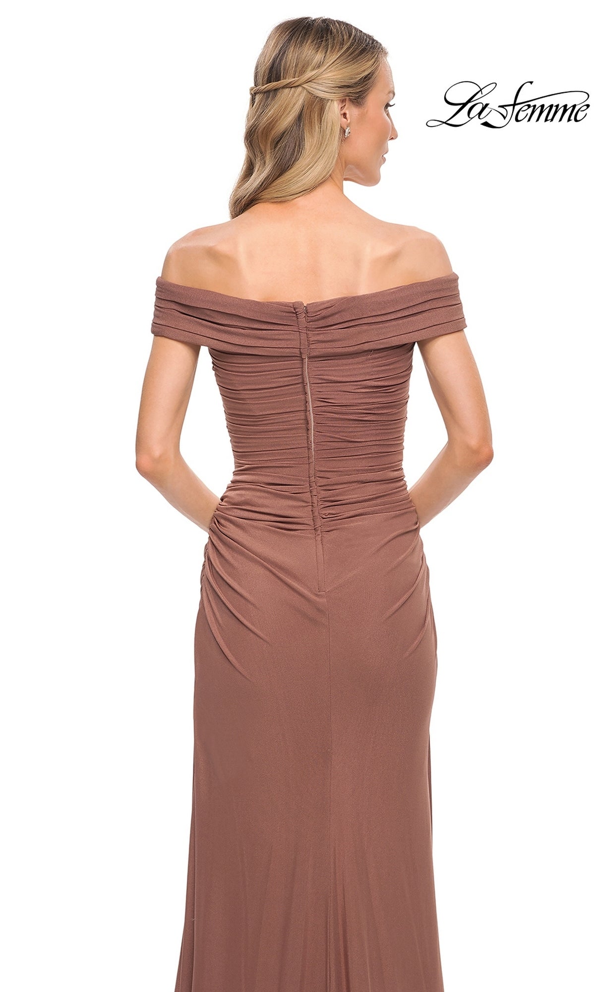 Woman wearing Long Formal Dress: La Femme 29541—an off-the-shoulder brown gown with ruched fitted bodice, wavy blonde hair, white background, “La Femme” logo top right.
