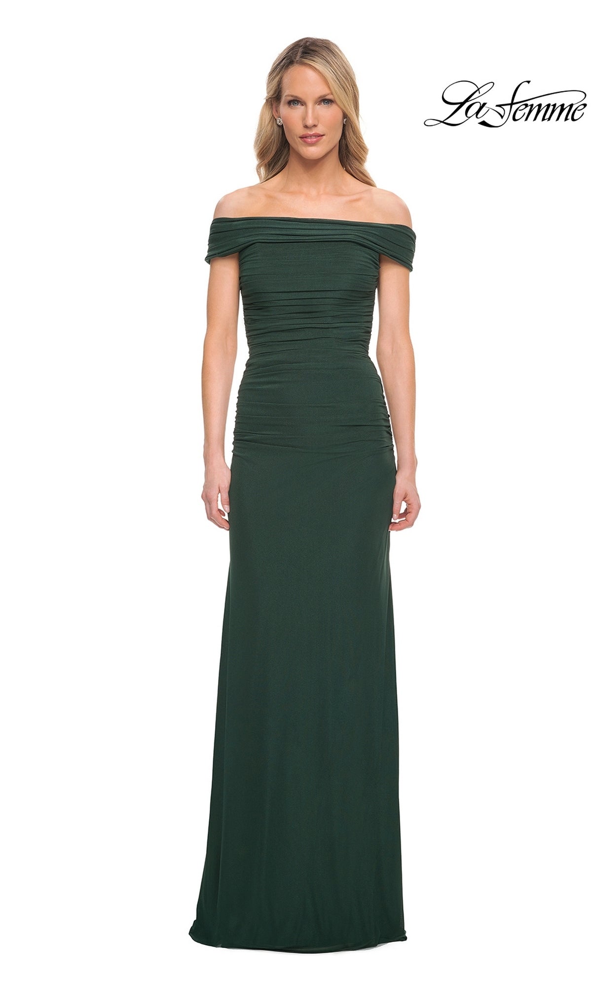 Woman in an emerald Long Formal Dress: La Femme 29541 with off-the-shoulder neckline poses against a white background, “La Femme” logo top right.