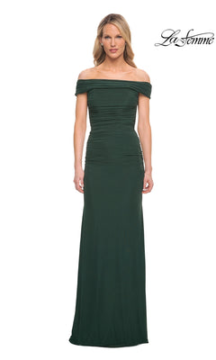 Woman in an emerald Long Formal Dress: La Femme 29541 with off-the-shoulder neckline poses against a white background, “La Femme” logo top right.
