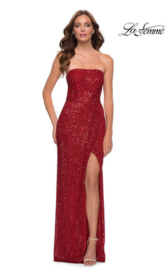 A woman wearing the La Femme Strapless Long Sequin Prom Dress 29681 in red, featuring a floor-length silhouette, thigh-high slit, and open back, is standing and facing forward.