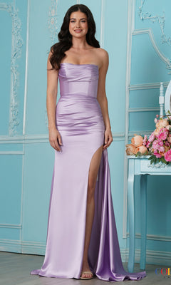 A woman in the Strappy-Back Strapless Long Satin Prom Dress 2968 stands by a blue table with flowers in a decorated room.