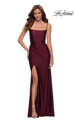 A woman models the La Femme Square-Neck Long Prom Dress 29710, a sleeveless burgundy gown with a ruched bodice, thigh-high slit, and spaghetti straps, standing against a white background with the "La Femme" logo in the top right.