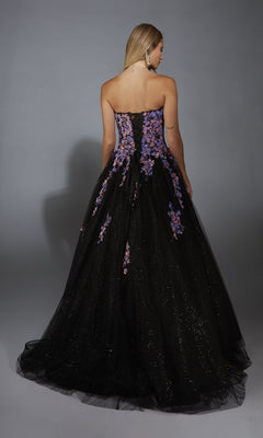 A woman faces away wearing the Strapless Glitter Prom Ball Gown: Aerie Couture 297, featuring purple and pink floral embroidery, a sparkling tulle skirt, and an elegant lace-up back.