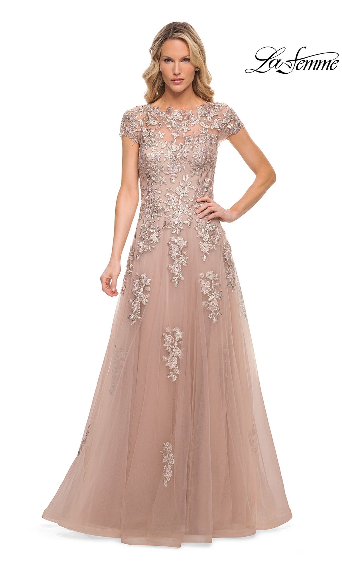 A blush-colored, floor-length La Femme 29829 formal dress with cap sleeves and floral lace appliques on the bodice.