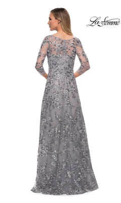 Woman elegantly shown from the back in Long Formal Dress: La Femme 29903, featuring silver metallic floral lace and sheer three-quarter sleeves.