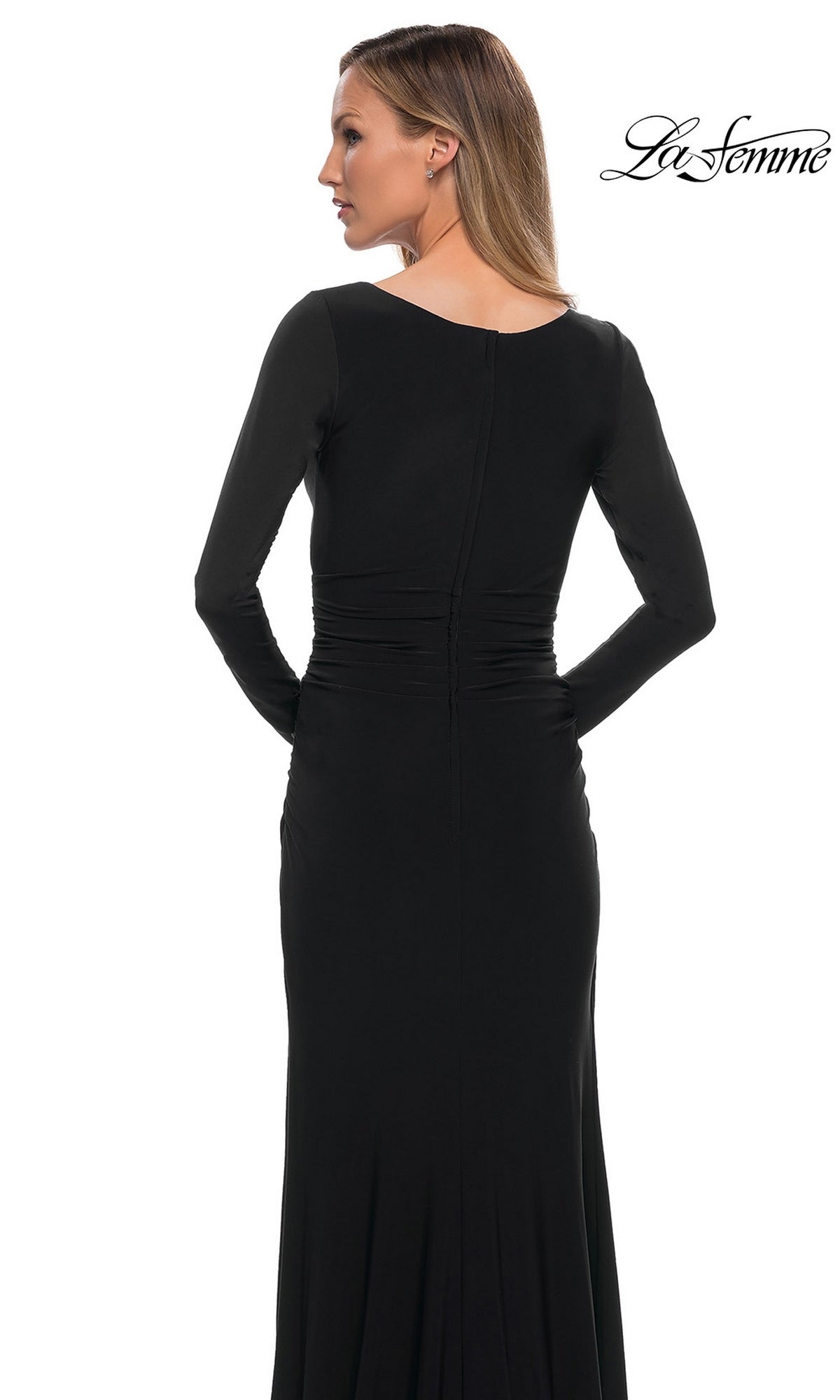 Back view of a woman wearing the Long Formal Dress: La Femme 29924, a floor-length black long-sleeved gown with a ruched bodice and gathered waist.