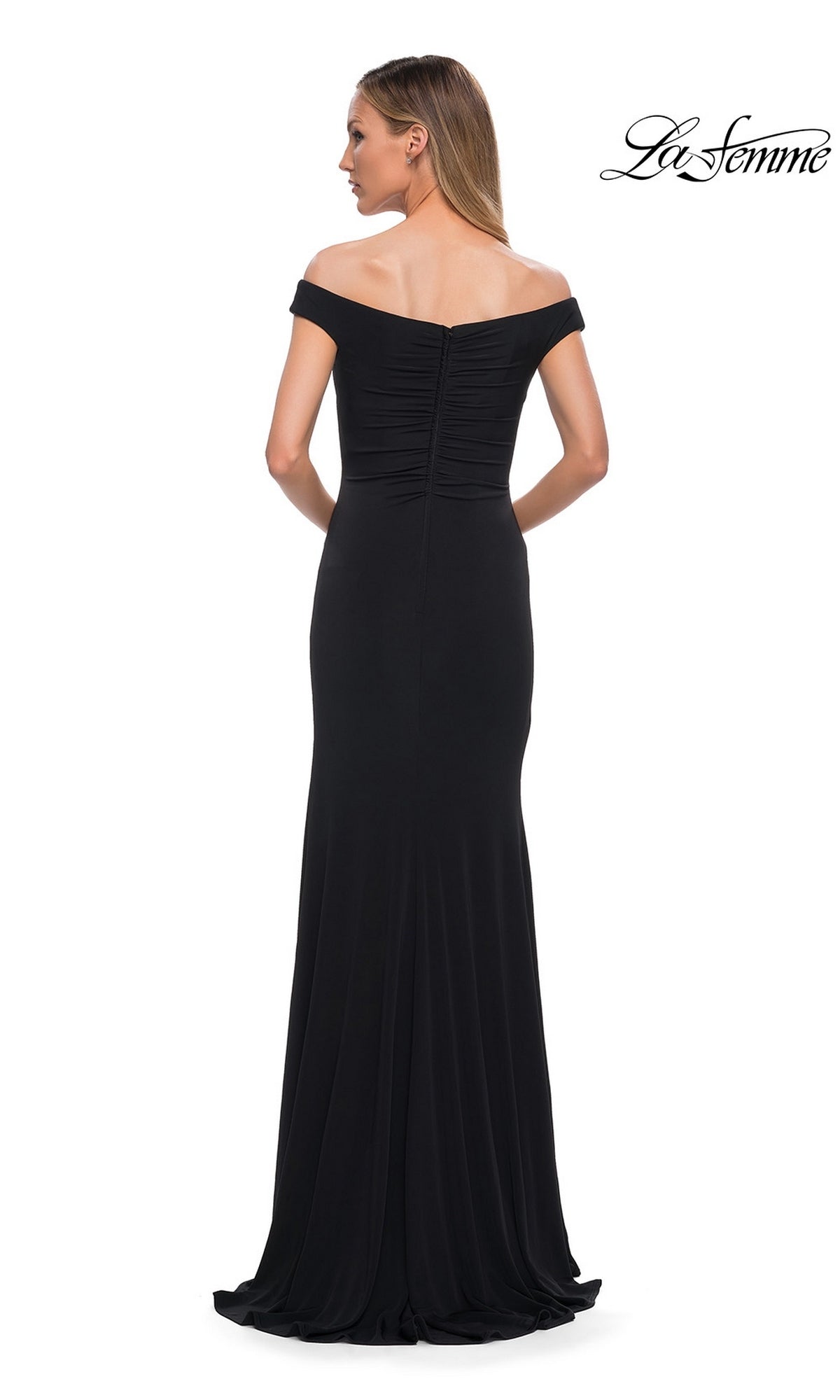 Back view of a woman wearing the Long Formal Dress: La Femme 29925, a floor-length, black ruffled off-the-shoulder gown with a ruched bodice.