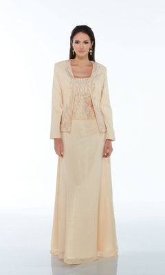 A woman models the Alyce 29953 long formal dress in light beige with a beaded top and matching jacket—ideal for a mother of the bride—against a plain white background.