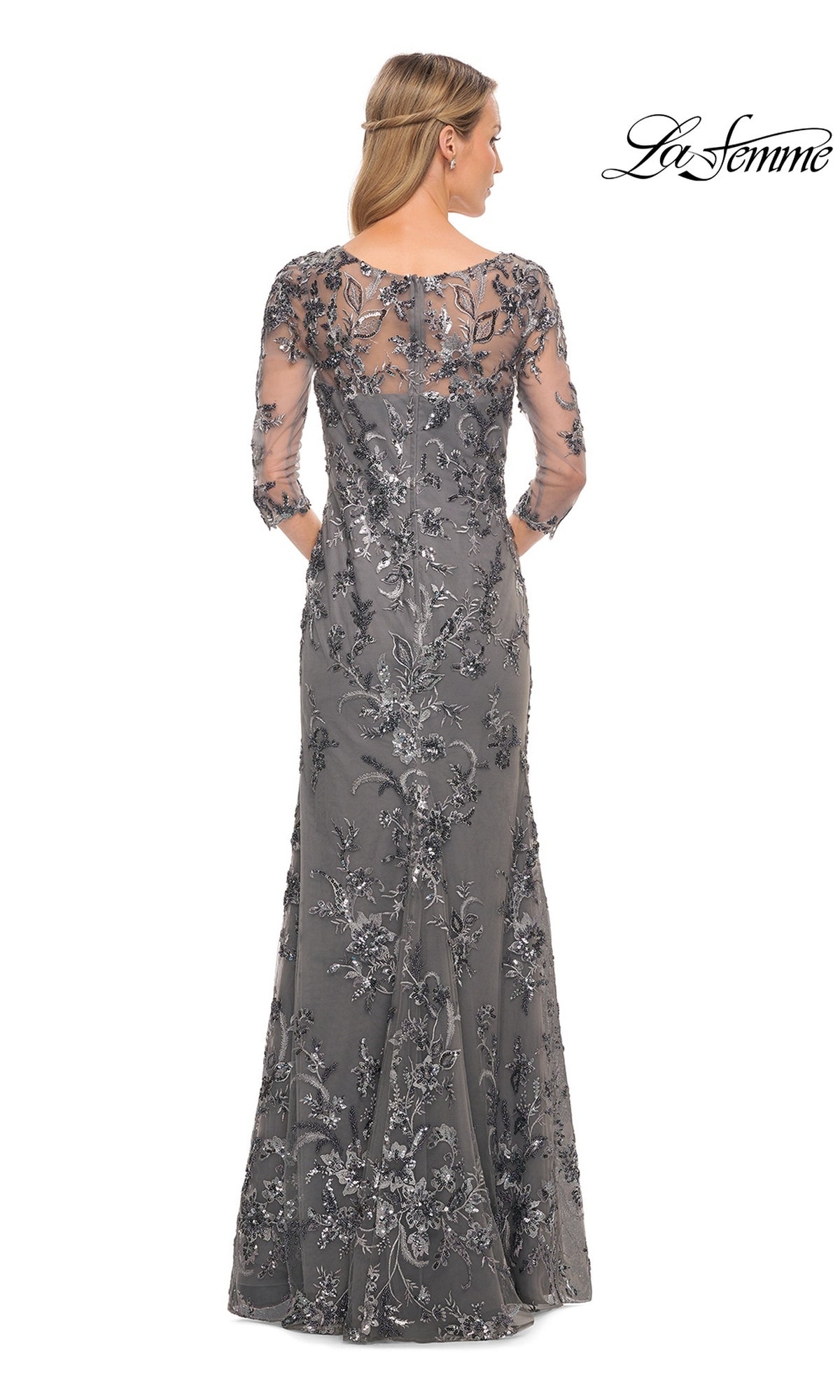 Back view of the Long Formal Dress: La Femme 29976, a modest, floor-length silver-grey gown with three-quarter sleeves, floral embroidery, and beaded appliques.
