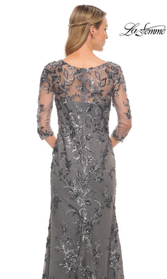 Back view of the Long Formal Dress: La Femme 29976, a modest silver-grey gown with three-quarter sleeves and a sheer floral-embroidered overlay featuring silver sequins.
