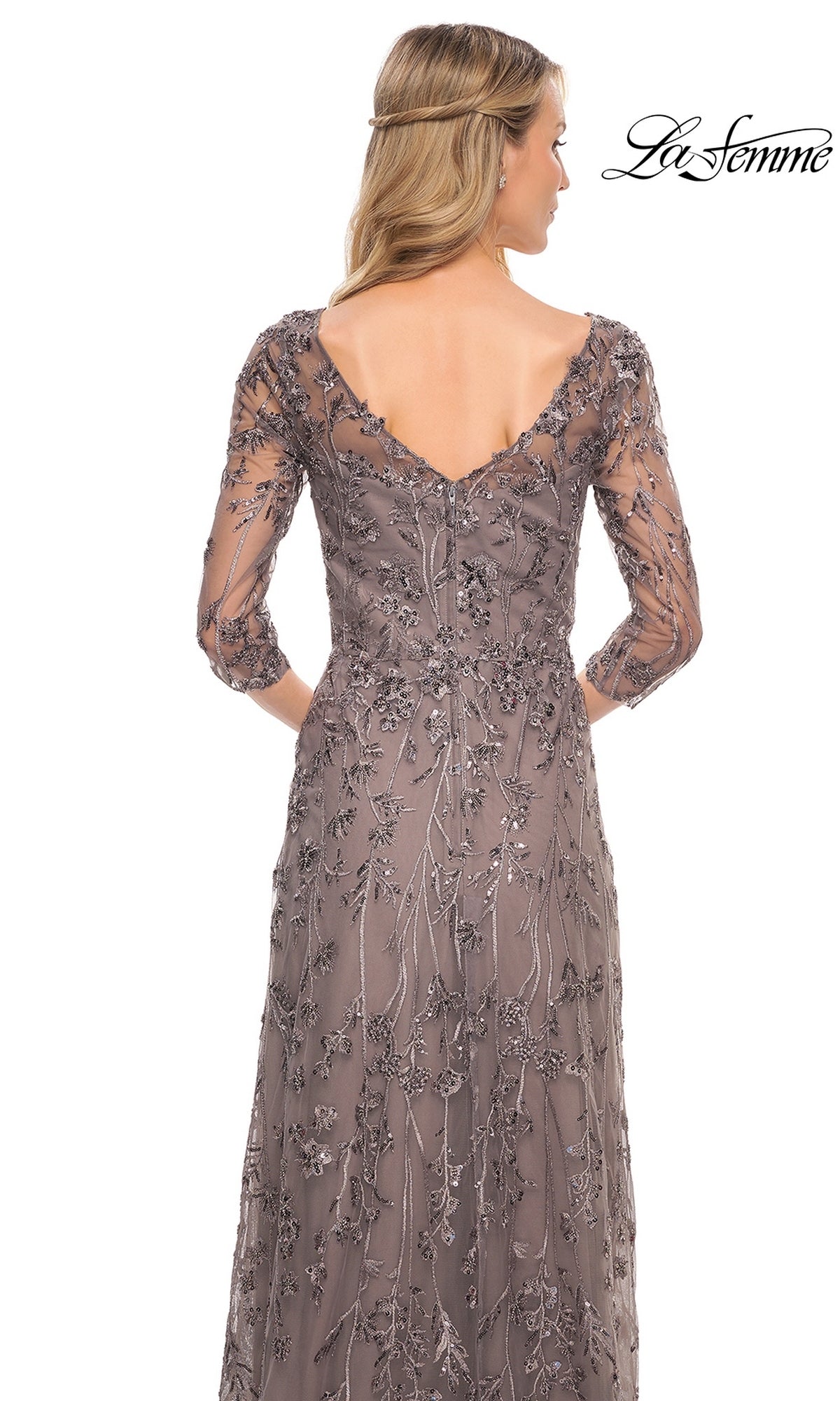 Back view of the Long Formal Dress: La Femme 29994, a taupe beaded lace dress with a V-neckline, three-quarter length sheer sleeves, and intricate floral sequin embroidery.