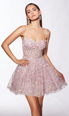 Model poses with one hand on her hip in the Alyce 30003 Short Homecoming Dress, featuring light pink color, thin straps, a sleeveless fitted bodice, and a flared skirt against a plain background.