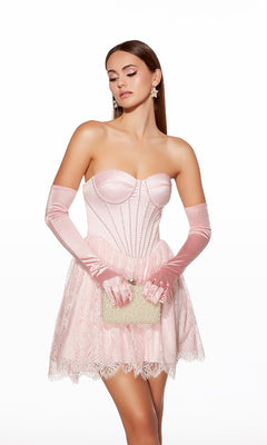 A woman in the strapless short corset hoco dress Alyce 30011 holds a textured clutch. She wears matching satin gloves, has long brown hair, and styles her look with drop earrings.