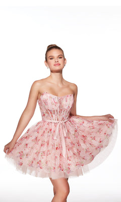 A woman models the Alyce 30019 Short Homecoming Dress—a pink floral, strapless, fit-and-flare style with a fitted bodice and flared skirt—against a plain white background.