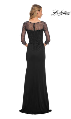Woman facing away in Long Formal Dress: La Femme 30028, featuring sheer beaded applique sleeves and back. “La Femme” logo in corner.