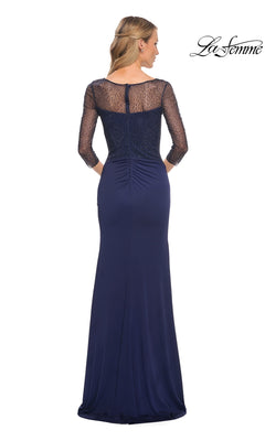 Woman in a floor-length navy Long Formal Dress: La Femme 30028 with beaded applique sleeves and sheer back, facing away; La Femme logo in top right.