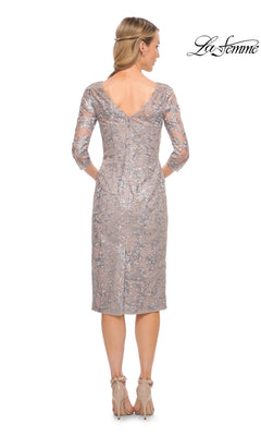 Back view of a woman in a taupe, three-quarter sleeve Midi Wedding Guest Dress: La Femme 30036 with an embroidered floral overlay, a v-neckline, and nude heeled sandals.