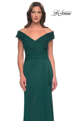 Woman wearing the Long Formal Dress: La Femme 30040—an off-the-shoulder emerald green, floor-length gown with ruched bodice, perfect for a mother-of-the-groom.