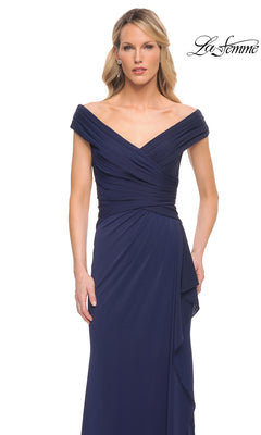 Woman in an off-the-shoulder, v-neck, navy blue “Long Formal Dress: La Femme 30040” with ruching detail stands against a plain white background. “La Femme” logo at top right.