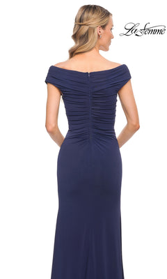 A woman in a ruched, off-the-shoulder v-neck navy gown faces away, her blonde hair in waves. “Long Formal Dress: La Femme 30040” logo is at the top right.