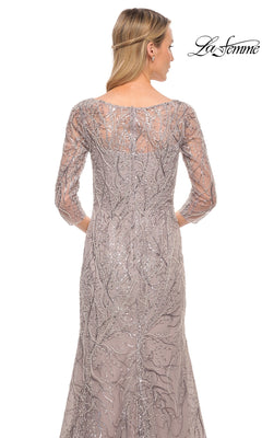 Back view of La Femme 30044, a taupe silver-grey lace gown with three-quarter sleeves, silver beaded vine patterns, and a fitted mermaid skirt.