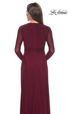 Back view of the Long Formal Dress: La Femme 30048, a floor-length, dark red jersey dress featuring long sleeves and a gathered waist.